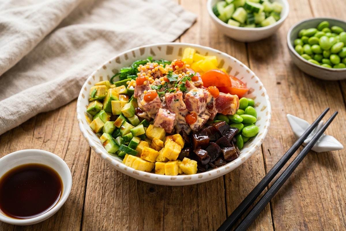 Colorful Asian bowl with edamame, avocado, tuna and soy sauce dipping bowl