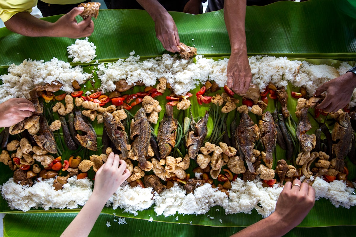 Kamayan feast with Filipino food on banana leaves