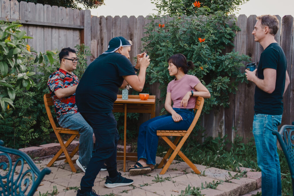 On the set of the short film Crosswalk, director Keili Fernando films a scene as writer Dennis Tran looks on