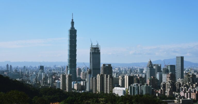 Taipei city skyline with Taipei 101 under a clear sky